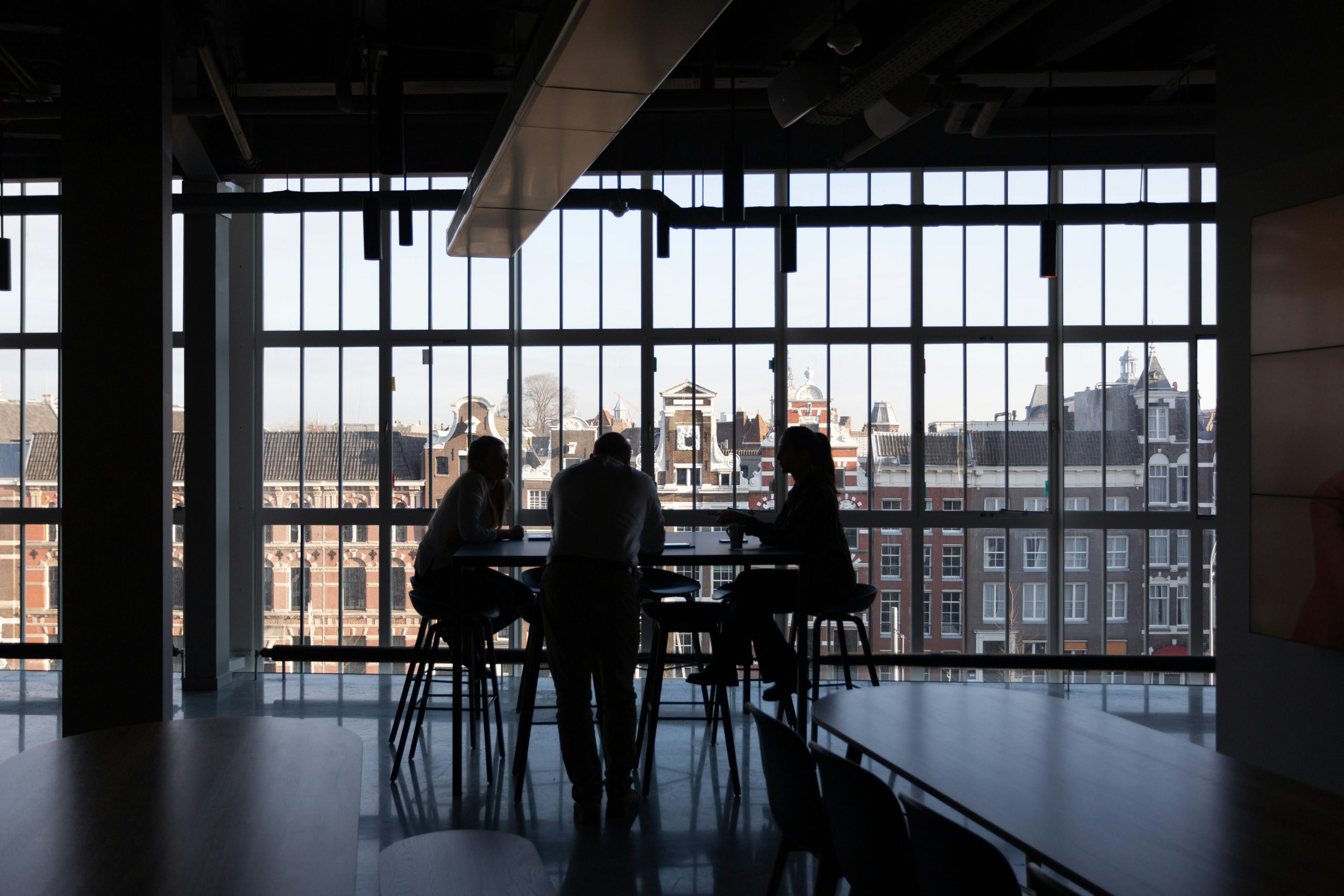 open work space with meeting taking place.